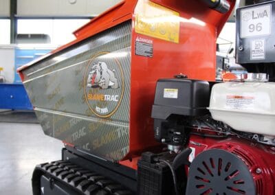 Image of a custom wrapped Slanetrac HT1000 mini track dumper at the Slanetrac engineering Limited facility