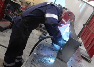 Image of a staff member welding at the Slanetrac Engineering Limited workshop