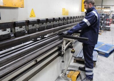 Image of a staff member doing some metal fabrication at the Slanetrac Engineering Limited production line