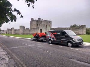 Image of Slanetrac Mini Track Dumpers on a trailer being towed by a Slanetrac Engineering Limited Van at Trim Castle County Meath